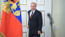 Президент России Владимир Путин перед началом встречи в режиме телемоста. Архивное фото Президент России Владимир Путин перед началом встречи в режиме телемоста. Архивное фото