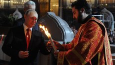 Путин на пасхальном богослужении в храме Христа Спасителя в Москве Путин на пасхальном богослужении в храме Христа Спасителя в Москве