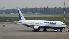 Боинг 777-2Q8ER авиакомпании Оренбургские авиалинии в московском аэропорту Шереметьево. Архивное фото Боинг 777-2Q8ER авиакомпании Оренбургские авиалинии в московском аэропорту Шереметьево. Архивное фото