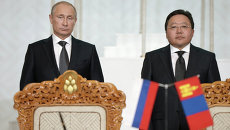 Президент России Владимир Путин (слева) и президент Монголии Цахиагийн Элбэгдорж. Архивное фото Президент России Владимир Путин (слева) и президент Монголии Цахиагийн Элбэгдорж. Архивное фото