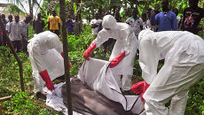 Employees crematorium evacuate a person's body, allegedly killed by the Ebola virus.  archival photo