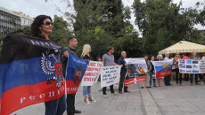 Жители Афин с флагами ДНР и РФ требовали объективно расследовать трагедию MH17 Жители Афин с флагами ДНР и РФ требовали объективно расследовать трагедию MH17
