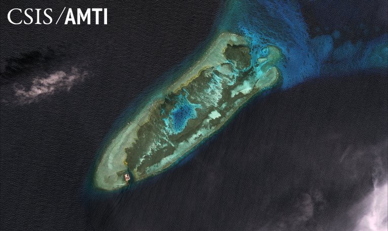 Спутниковое изображение спорных островов Спратли в Южно-Китайском море Спутниковое изображение спорных островов Спратли в Южно-Китайском море