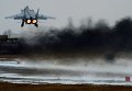 Истребитель МиГ-31 совершает взлет во время летно-тактических учений истребительной авиации Восточного военного округа на аэродроме Центральная Угловая в Приморском крае Истребитель МиГ-31 совершает взлет во время летно-тактических учений истребительной авиации Восточного военного округа на аэродроме Центральная Угловая в Приморском крае