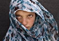 9-летняя сирийская беженка в лагере в окрестностях города Эль-Мафрак, Иордания 9-летняя сирийская беженка в лагере в окрестностях города Эль-Мафрак, Иордания