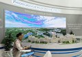Стенд с макетом архитектурного комплекса в конгрессно-выставочном комплексе ЭкспоФорум перед открытием XX Санкт-Петербургского международного экономического форума Стенд с макетом архитектурного комплекса в конгрессно-выставочном комплексе ЭкспоФорум перед открытием XX Санкт-Петербургского международного экономического форума