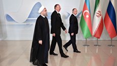 Президент России Владимир Путин, президент Азербайджанской Республики Ильхам Алиев и президент Исламской Республики Иран Хасан Рухани в Центре Гейдара Алиева в Баку. 8 августа 2016 Президент России Владимир Путин, президент Азербайджанской Республики Ильхам Алиев и президент Исламской Республики Иран Хасан Рухани в Центре Гейдара Алиева в Баку. 8 августа 2016