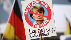 Акция протеста против политики Ангелы Меркель в Берлине Акция протеста против политики Ангелы Меркель в Берлине
