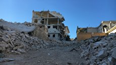 Разрушенные улицы лагеря палестинских беженцев Хандарат на северо-востоке Алеппо Разрушенные улицы лагеря палестинских беженцев Хандарат на северо-востоке Алеппо