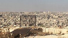 Захваченные боевиками восточные кварталы Алеппо. Вид из Цитадели в старом городе Захваченные боевиками восточные кварталы Алеппо. Вид из Цитадели в старом городе