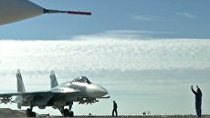 Истребитель Су-33 перед взлетом с палубы крейсера Адмирал Кузнецов. Архивное фото Истребитель Су-33 перед взлетом с палубы крейсера Адмирал Кузнецов. Архивное фото