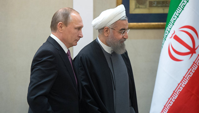 Президент России Владимир Путин и президент Исламской Республики Иран Хасан Роухани. Архивное фото