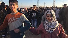 Жители Алеппо после вывода боевиков и членов их семей из восточного Алеппо Жители Алеппо после вывода боевиков и членов их семей из восточного Алеппо