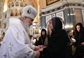 Патриарх Московский и всея Руси Кирилл и Марина Карлова во время отпевания российского дипломата в храме Христа Спасителя Патриарх Московский и всея Руси Кирилл и Марина Карлова во время отпевания российского дипломата в храме Христа Спасителя