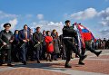 Возложение венка и цветов во время митинга в честь третьей годовщины воссоединения Крыма с Россией на мысе Хрустальный в Севастополе Возложение венка и цветов во время митинга в честь третьей годовщины воссоединения Крыма с Россией на мысе Хрустальный в Севастополе
