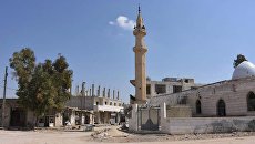 Разрушенные здания на одной из улиц города Дейр-Хафир в провинции Алеппо. Архивное фото Разрушенные здания на одной из улиц города Дейр-Хафир в провинции Алеппо. Архивное фото