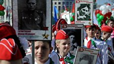 Участники шествия Бессмертный полк в честь 71-й годовщины Победы в Великой Отечественной войне в Минске. Архивное фото Участники шествия Бессмертный полк в честь 71-й годовщины Победы в Великой Отечественной войне в Минске. Архивное фото