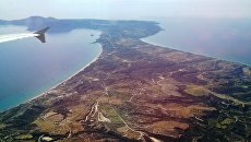 Вид на остров Кос с борта самолета. Архивное фото Вид на остров Кос с борта самолета. Архивное фото