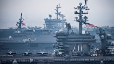 Авианосцы США Карл Винсон и Рональд Рейган во время учений в Японском море. Архивное фото Авианосцы США Карл Винсон и Рональд Рейган во время учений в Японском море. Архивное фото