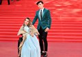 Российская певица Юлия Самойлова и её супруг, музыкант Алексей Таран на церемонии открытия 39-го Международного Московского кинофестиваля Российская певица Юлия Самойлова и её супруг, музыкант Алексей Таран на церемонии открытия 39-го Международного Московского кинофестиваля
