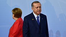 Канцлер Германии Ангела Меркель и президент Турции Реджеп Тайип Эрдоган. Архивное фото Канцлер Германии Ангела Меркель и президент Турции Реджеп Тайип Эрдоган. Архивное фото