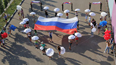 Участники флешмоб Я люблю Россию, приуроченный ко Дню государственного флага в Реутове. 22 августа 2017 Участники флешмоб Я люблю Россию, приуроченный ко Дню государственного флага в Реутове. 22 августа 2017