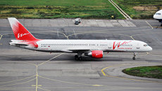 Пассажирский самолет Боинг 757 авиакомпании ВИМ-авиа в аэропорту Домодедово. Архивное фото Пассажирский самолет Боинг 757 авиакомпании ВИМ-авиа в аэропорту Домодедово. Архивное фото