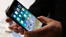 Смартфон iPhone. Архивное фото Смартфон iPhone. Архивное фото