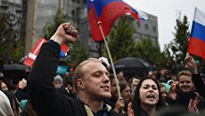 Участники несанкционированной акции на Пушкинской площади в Москве. 7 октября 2017 Участники несанкционированной акции на Пушкинской площади в Москве. 7 октября 2017