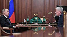 Президент РФ Владимир Путин и директор Федеральной службы по финансовому мониторингу Юрий Чиханчин во время встречи. Архивное фото Президент РФ Владимир Путин и директор Федеральной службы по финансовому мониторингу Юрий Чиханчин во время встречи. Архивное фото