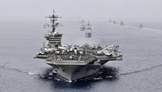 Американская ударная авианосная группа во главе с USS Bunker Hill (CG 52) на военно-морских учениях в Индийском океане. Архивное фото Американская ударная авианосная группа во главе с USS Bunker Hill (CG 52) на военно-морских учениях в Индийском океане. Архивное фото