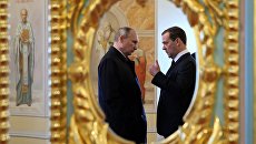 Президент РФ Владимир Путин и председатель правительства РФ Дмитрий Медведев. Архивное фото Президент РФ Владимир Путин и председатель правительства РФ Дмитрий Медведев. Архивное фото