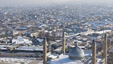 Вид на город Ош с горы Сулейман-Тоо. Архивное фото Вид на город Ош с горы Сулейман-Тоо. Архивное фото
