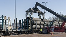 Нанесение бетонного покрытия на трубы для газопровода Северный поток ‑ 2. Архивное фото Нанесение бетонного покрытия на трубы для газопровода Северный поток ‑ 2. Архивное фото