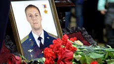 Портрет погибшего в Сирии летчика Романа Филипова. Архивное фото Портрет погибшего в Сирии летчика Романа Филипова. Архивное фото
