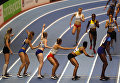 Спортсмены во время финала женской эстафеты 4x400 м на чемпионате мира по легкой атлетике в помещении на арене National Indoor Arena в Бирмингеме, Великобритания. 4 марта 2018 года Спортсмены во время финала женской эстафеты 4x400 м на чемпионате мира по легкой атлетике в помещении на арене National Indoor Arena в Бирмингеме, Великобритания. 4 марта 2018 года