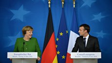 Канцлер Германии Ангела Меркель и президент Франции Эммануэль Макрон на саммите ЕС в Брюсселе. 23 марта 2018 Канцлер Германии Ангела Меркель и президент Франции Эммануэль Макрон на саммите ЕС в Брюсселе. 23 марта 2018