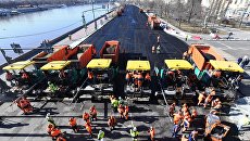 Ремонт дорожного полотна на Фрунзенской набережной в Москве Ремонт дорожного полотна на Фрунзенской набережной в Москве