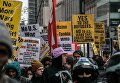 Участники акции протеста против ударов по Сирии в Нью-Йорке Участники акции протеста против ударов по Сирии в Нью-Йорке
