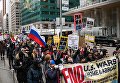 Участники акции протеста против ударов по Сирии в Нью-Йорке Участники акции протеста против ударов по Сирии в Нью-Йорке