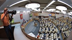 Фоторепортер на пленарном заседании Государственной Думы РФ Фоторепортер на пленарном заседании Государственной Думы РФ