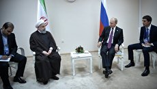 Владимир Путин и президент Ирана Хасан Роухани во время встречи в рамках саммита глав государств-участников V Каспийского саммита в Актау. 12 августа 2018 Владимир Путин и президент Ирана Хасан Роухани во время встречи в рамках саммита глав государств-участников V Каспийского саммита в Актау. 12 августа 2018