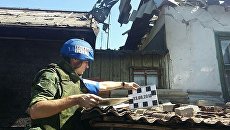 Последствия обстрела со стороны украинских силовиков. Архивное фото Последствия обстрела со стороны украинских силовиков. Архивное фото