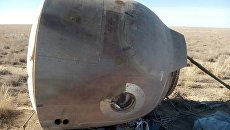 Капсула с членами основного экипажа МКС-57/58 космонавтом Роскосмоса Алексеем Овчининым и астронавтом NASA Ником Хейгом после аварийной посадки в степи Казахстана. 11 октября 2018 Капсула с членами основного экипажа МКС-57/58 космонавтом Роскосмоса Алексеем Овчининым и астронавтом NASA Ником Хейгом после аварийной посадки в степи Казахстана. 11 октября 2018