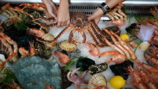 Морепродукты на рыбном рынке. Архивное фото Морепродукты на рыбном рынке. Архивное фото