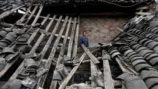 Последствия землетрясения в провинции Сычуань на юго-западе Китая Последствия землетрясения в провинции Сычуань на юго-западе Китая